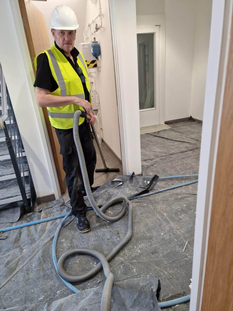 David from safezone team working on an industrial builders clean