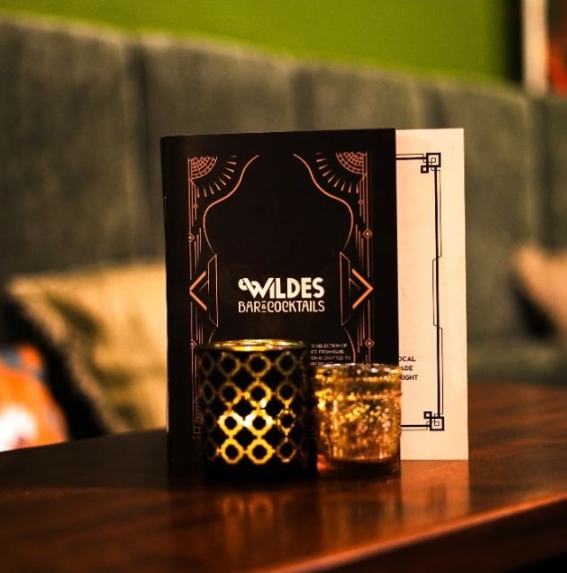 Wildes Cocktail and Bar menu with candles